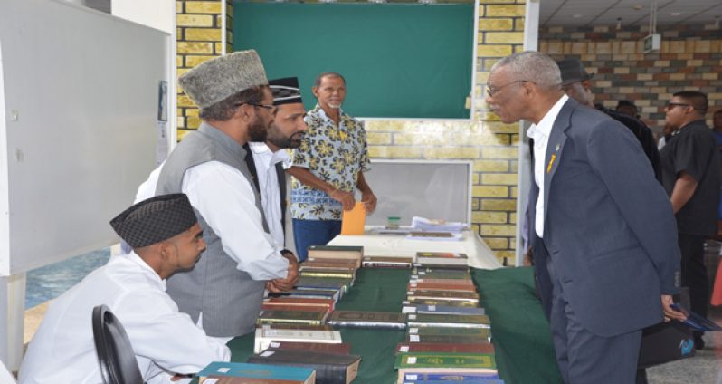 President David Granger learning more of the Muslim faith shortly after the launch