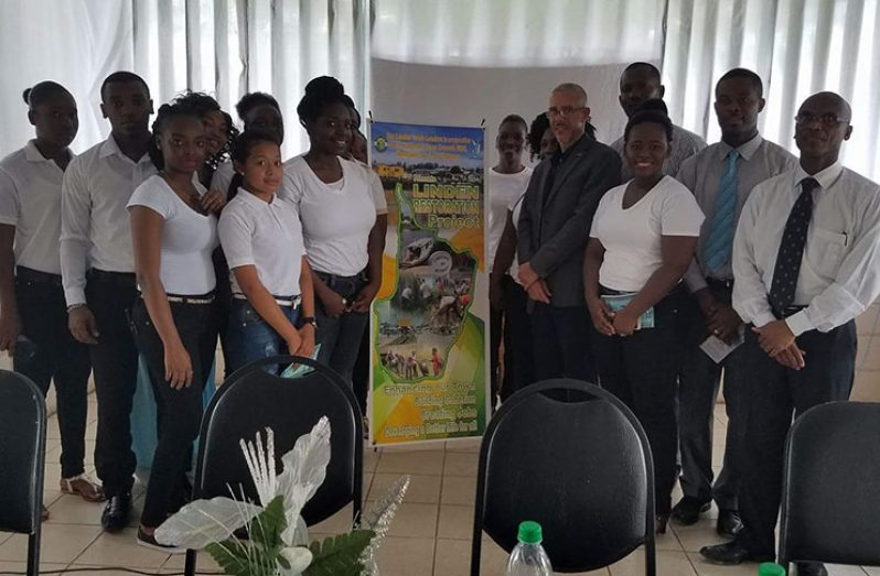 Some of the members of the Linden Youth Leaders pose with Minister of Business Dominic Basking ( first right) and Mayor of Linden Carwyn Holland also right