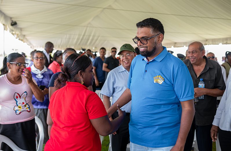 President, Dr Irfaan Ali greets residents during a Presidential Outreach to Region Three (Delano Williams photo)