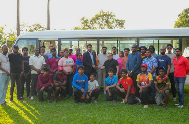 Irfaan (1) Minister of Sport Charles Ramson Jnr Hands over the keys to the Guyana Cricket Board President Bissoondyal Singh in the presence of President Irfaan Ali (centre)
