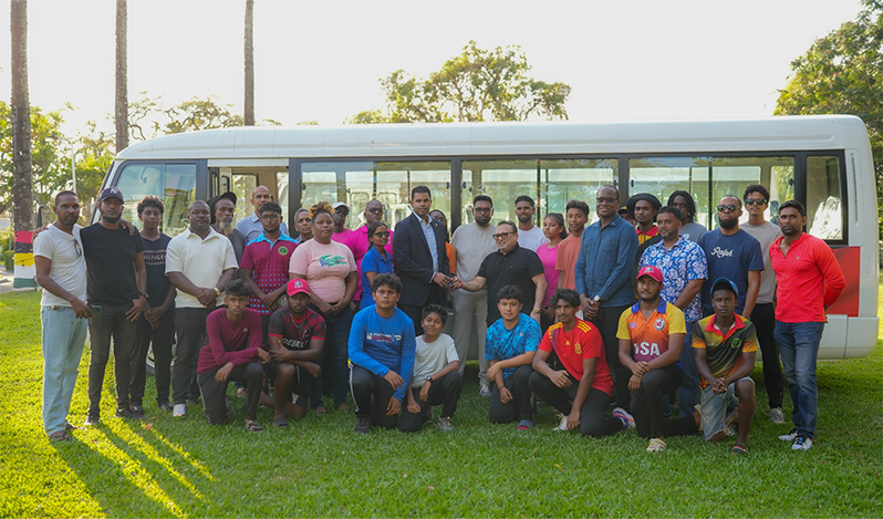Irfaan (1) Minister of Sport Charles Ramson Jnr Hands over the keys to the Guyana Cricket Board President Bissoondyal Singh in the presence of President Irfaan Ali (centre)