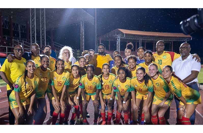 President Dr. Irfaan Ali and other officials with the Lady Jags after the match (PHOTO: News Room/Jeremy Jagroop)