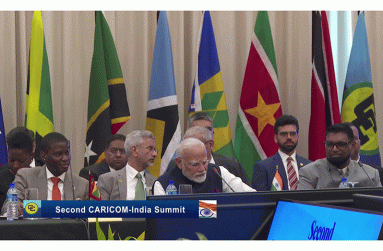 India's PM Narendra Modi (centre)
address CARICOM alongside President
Irfaan Ali (right) and CARICOM Chair
Dickon Mitchell (left)