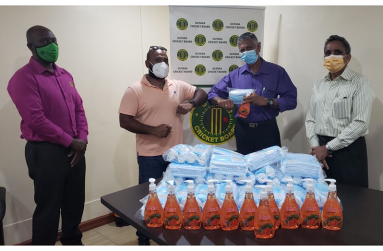 GuyBiz Ishwar Singh and GCB executives during their recent donation ceremony