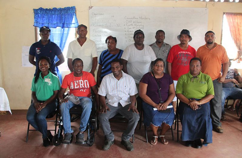 Head of the Co-operative Department Perlina Gifth (seated right) with members of the society