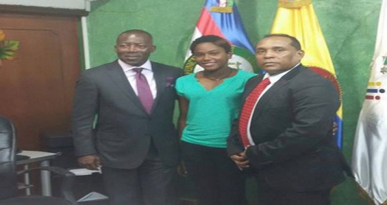 GASA president Ivan Persaud (right) with scholarship awardee Jamila Sanmoogan (centre) and Director of Colombia's National School of Sport, Jose Fernando Arroyo Valencia