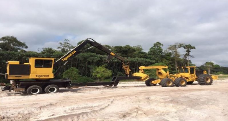 The Tigercat 234 Knuckleboom loader (left) and the Tigercat 635D Skidder