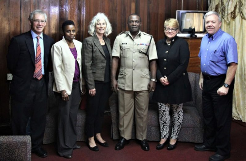 Crime Chief, Assistant Commissioner Paul Williams poses with  Strengthening the Criminal Justice System in Guyana project team .(L-R) Judge Michael Hicks (retired), Rolinda Kirton, Evelyn Neaman, Paul Williams, Sonia Poulin, and James Hardy.