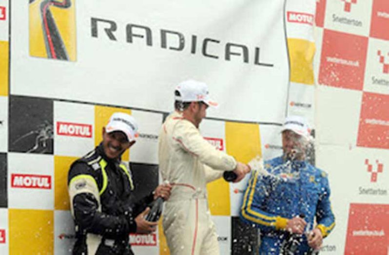 (L-R) Kristian Jeffrey, Dominik Jackson and Steve Burgess enjoy the podium celebrations.

Photo credit: Ollie Read