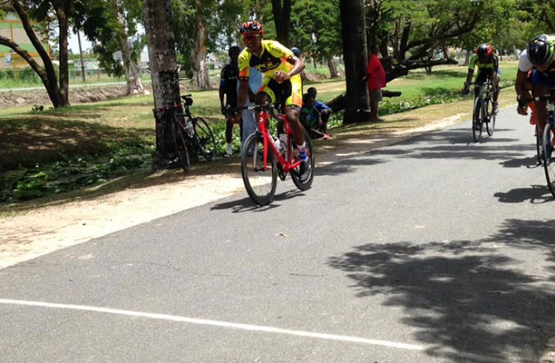 Team Coco’s Jamual John crosses the finish line to take the feature event of the 9th Annual Rainforest Waters 11-race cycling meet.