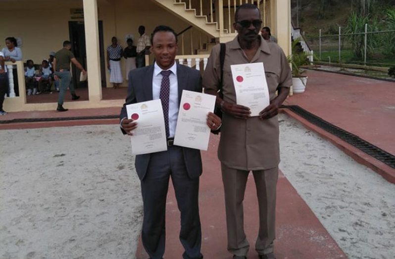 MP Jermaine Figueira and entrepreneur Ewart Forrester after they were sworn in on Monday