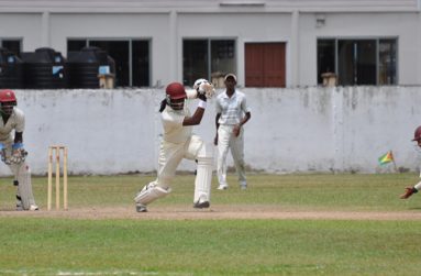Great shot Steven! From left, wicketkeeper Kevon Boodie, Parmesh Parsotam and Mark Gonsalves (stooping) look on admirably as GCB Developmental XI skipper Steven Jacobs drives down the ground yesterday.