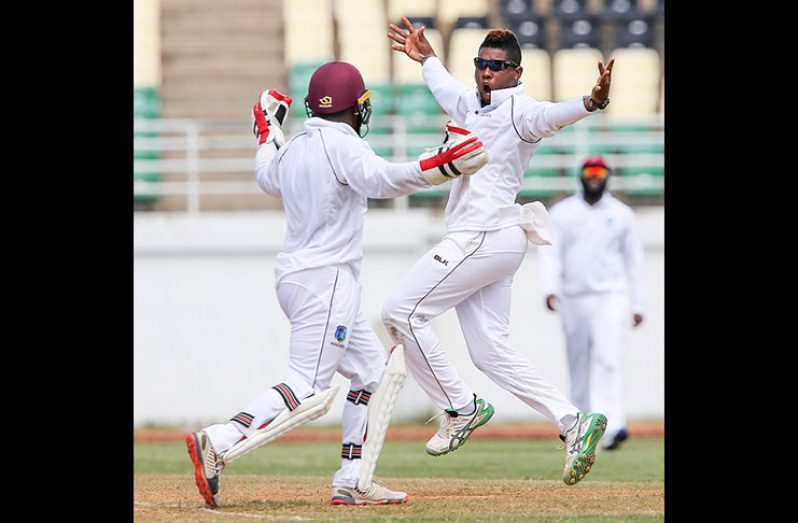 Leg-spinner Damion Jacobs celebrates another wicket with wicketkeeper Jahmar Hamilton, on the final day of the opening four-day “Test” on Saturday. (Photo courtesy CWI Media)