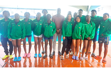 Minister Steven Jacobs (centre) with IGG swimming Champions Suriname (Sean Devers photo)