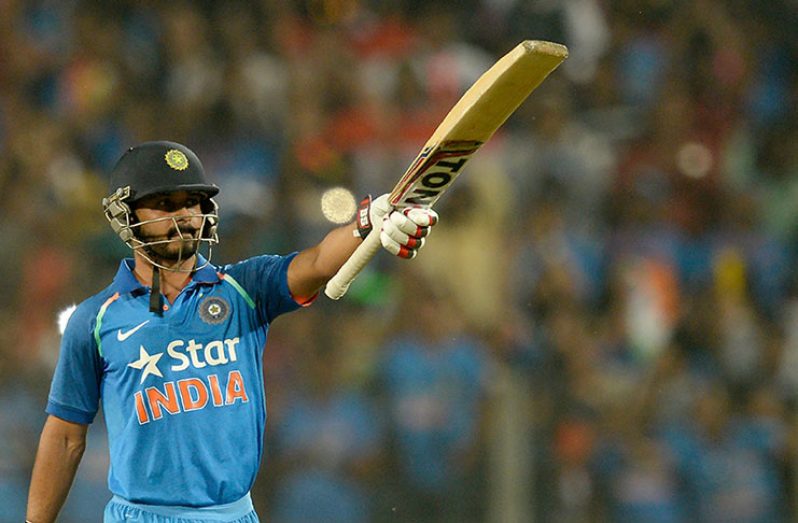 Kedar Jadhav celebrates a century in front of his home crowd against  England in Pune.