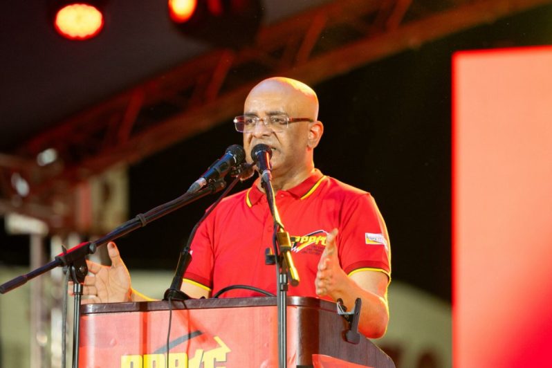 Vice-President, Dr Bharrat Jagdeo, addressing a sea of supporters clad in red at Lusignan on Saturday (DPI)