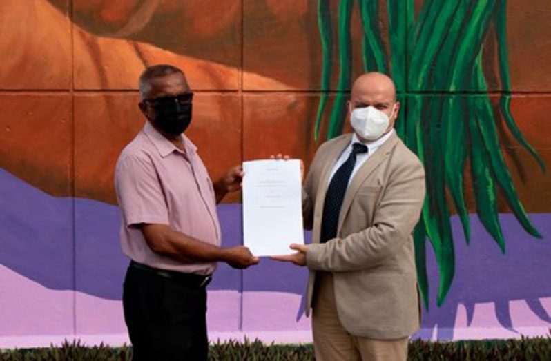Chief Executive Officer of NAREI, Jagnarine Singh and General Manager of SBM Offshore, Francesco Prazzo display the signed agreement (DPI photo)