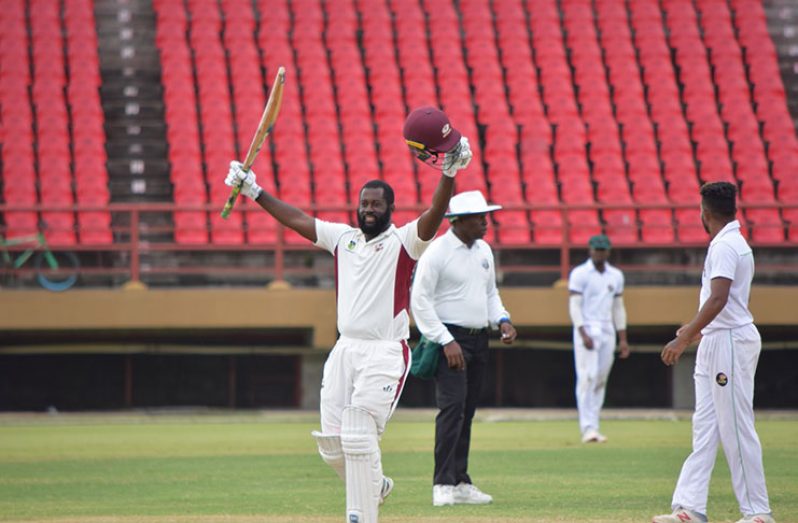 Montcin Hodge acknowledges his teammates after scoring his fourth first-class hundred. (Adrine Narine photos)