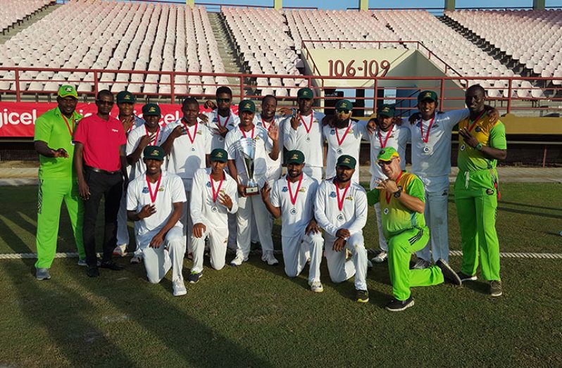 The Guyana Jaguars pose for a photo after winning their third straight Regional four-day title.