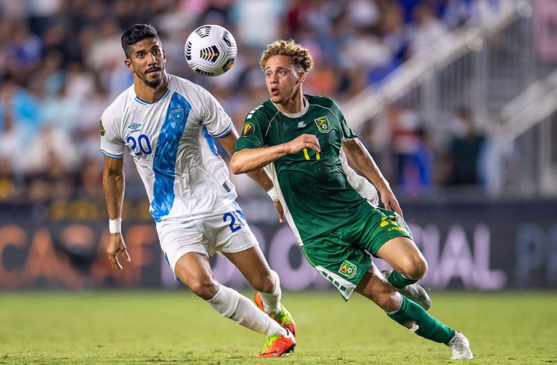 Stephen Duke-McKenna getting by Guatemala’s Gerardo Gordillo during the Golden Jaguars’ 2021 Gold Cup preliminary round clash at the Drive Pink Stadium in Fort Lauderdale, Florida on Saturday July 3. (Photo compliments: CONCACAF)