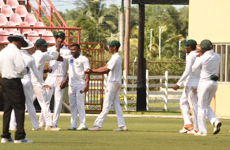 Veerasammy Permaul and his teammates celebrates the final wicket of Jason Dawes. (Adrian Narine photo)