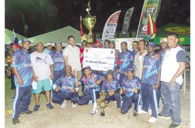 The victorious Jai Hind team and supporters pose with Minister of Culture, Youth and Sport, Charles Ramson