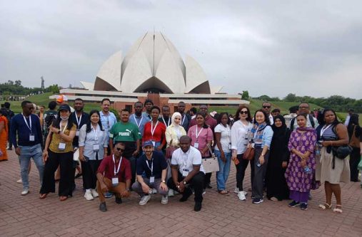 Mr. Jainarine Deonauth, Communications Director at the University of Guyana (first left, in kneeling position) with other participants of the course at the Lotus Temple in New Delhi