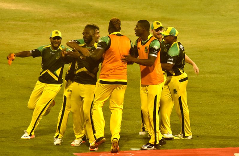 The Jamaica Tallawahs players celebrate after their victory last evening.