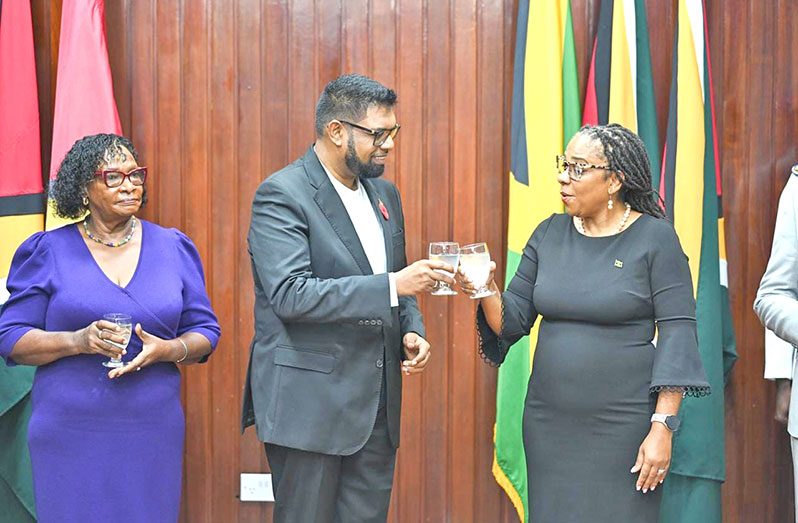 President Dr. Irfaan Ali shares a toast with High Commissioner of Jamaica to Guyana, HE Natalie Campbell-Rodrigues (Office of the President photo)