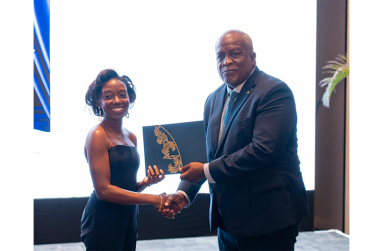 Jamella Chesney receiving the award from the Prime Minister of Guyana, Hon. Brig (Ret’d) Mark Phillips