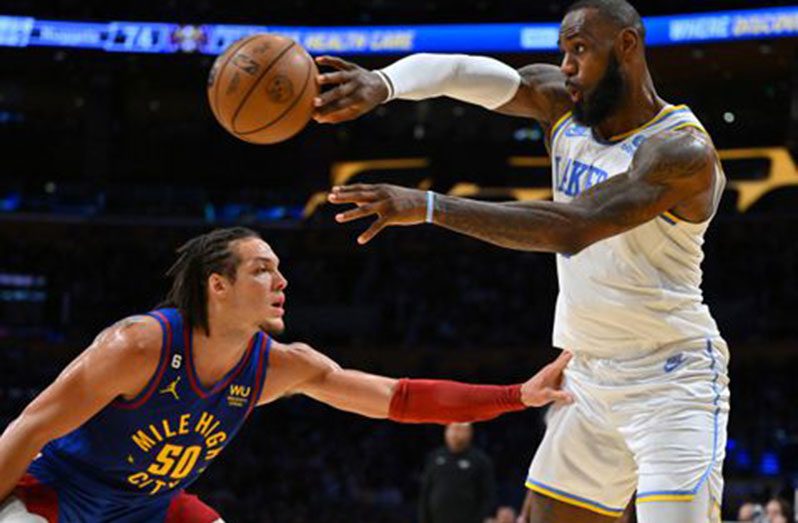 Los Angeles, California, USA; Denver Nuggets forward Aaron Gordon (50) guards Los Angeles Lakers forward LeBron James (6) in the second half at Crypto.com Arena. Mandatory Credit: Jayne Kamin-Oncea-USA TODAY Sports