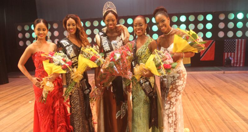 Miss Jamzone International, Soyini Fraser (centre) and her happy runners-up. From left are Miss Jamaica, Joanna Sadler; Miss Bahamas, Lexie Wilson; Miss Barbados, Dannyele Leslie; and Miss Trinidad and Tobago, Yaya Henry