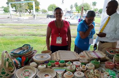 Janette’s daughter Shereen stands with some of the craft pieces of Janette’s Handmade Products