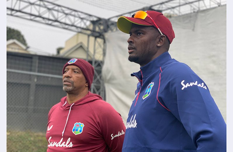 West Indies Test captain, Jason Holder (right) and head coach, Phil Simmons, having a chat