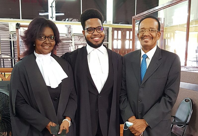 New attorney-at-law, Jason Barnes (centre) with his mother, Justice Dawn Gregory and father, John Barnes