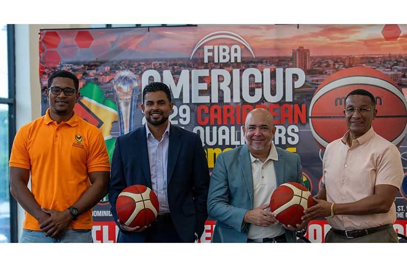 From left: Vice-President of the Guyana Basketball Federation, Jermaine Slater, Minister Charles Ramson Jr., President of the Guyana Basketball Federation, Michael Singh and Co-Director of the Kashif and Shanghai Organisation, Kashif Muhammad, after the ceremonial signing (PHOTO: News Room/Davin Ramnarine)