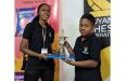 Aquilani Swaminadha collects his award from Jessica Callender of the Guyana Chess Federation