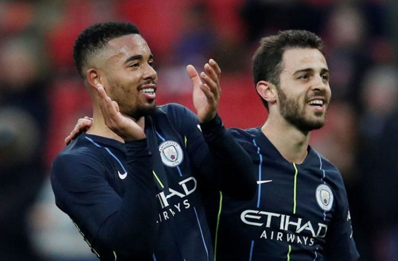 Manchester City's Bernardo Silva and Gabriel Jesus celebrate after the match. (REUTERS/David Klein)