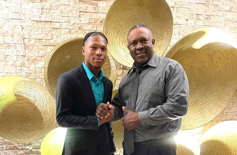 Jewel Andrew receives his Junior Sportsman of the Year award from Antigua’s Minister of Sports and Education Darryl Matthews