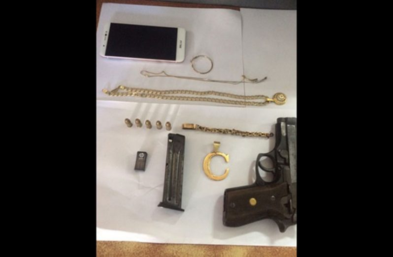 The firearm and jewellery recovered by police