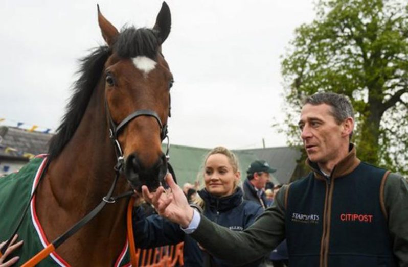 Jockey Davy Russell accompanied Tiger Roll at the homecoming parade in Summerhill on Sunday