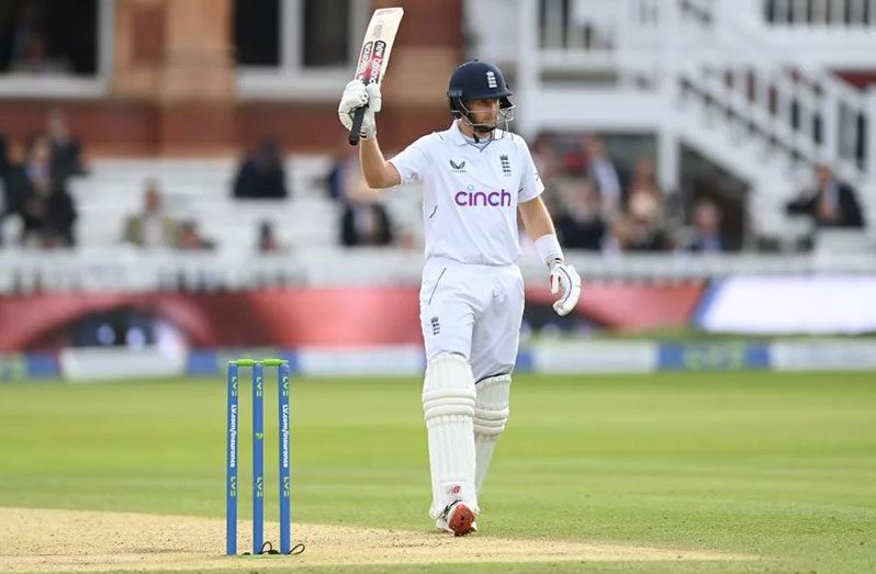 Joe Root raises his bat after his half-century (Getty Images)