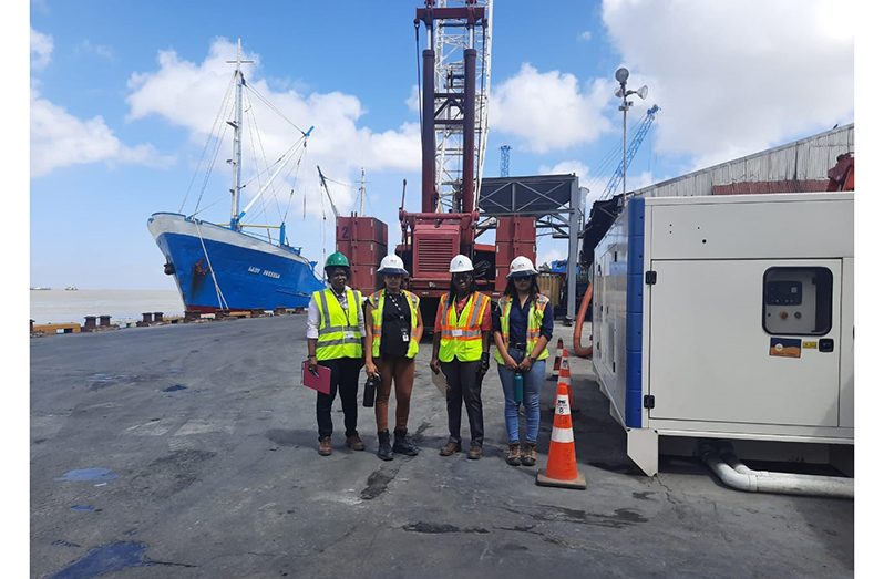 (At left) OSH Officers, Ms. Neza King; (third from left) OSH officer Ms. Johana Vaughn along with John Fernandes Limited Port Facility staff at the scene of the tragic incident on Tuesday morning