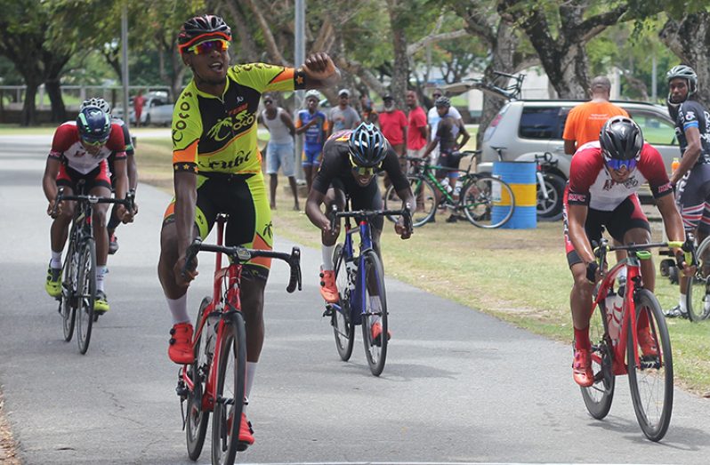 Jamaul John celebrates as he crosses the line ahead of the pack.