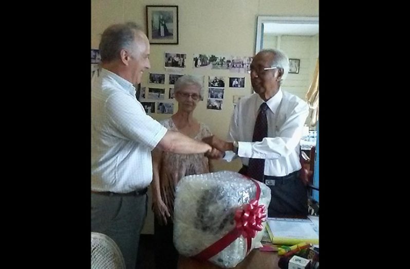 Ambassador Roland de Rosiere of the Sovereign Order of Malta,  Mrs. Olga Christiani - Council Member and Vibert Parvatan - Chairman of St. John Association Guyana.