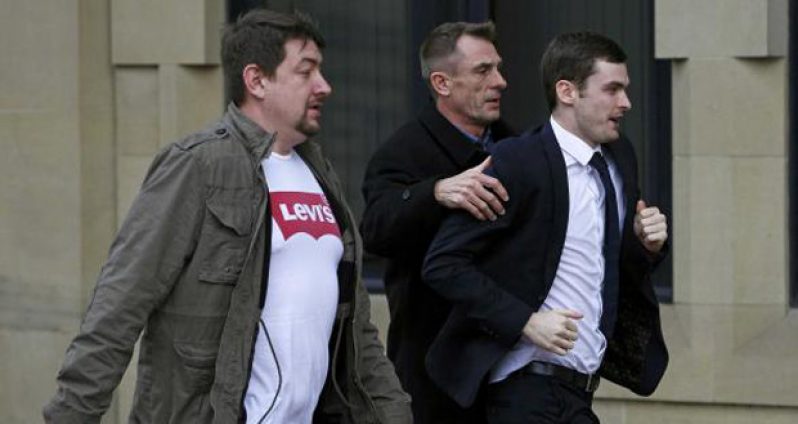 Former Sunderland soccer player Adam Johnson (R) arrives for sentencing at Bradford Crown Court in Bradford, Britain, yesterday. (Reuters/Craig Brough)