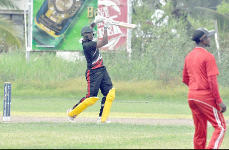 Leon Jonson goes down the ground against Upper Corentyne Corentyne.