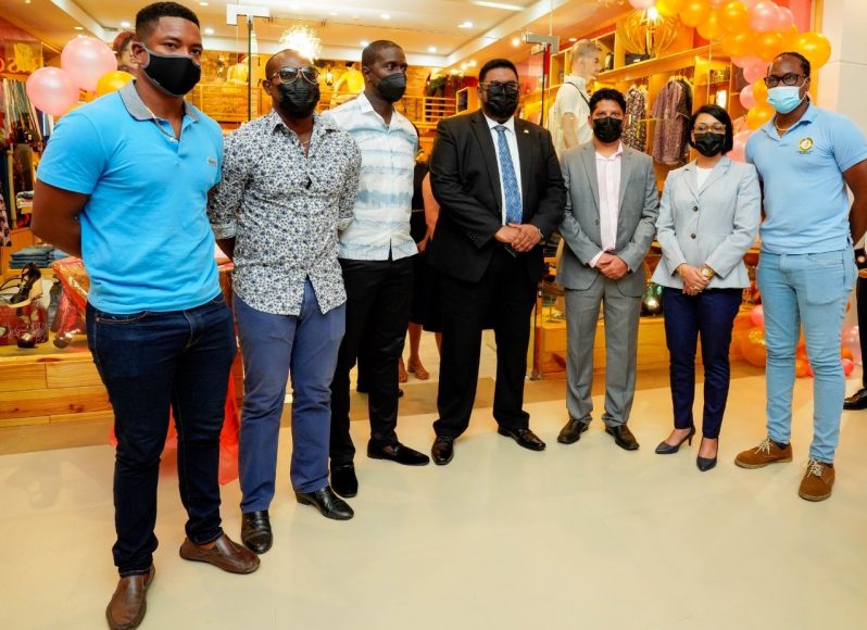 President Irfaan Ali (centre) and Minister within the Ministry of Housing and Water, Susan Rodrigues (second from right), pose with cricketers (l-r) Leon Johnson, Travis Dowlin, Lennox Cush, Ramnaresh Sarwan (third from right) and Steven Jacobs (right) at the Amazonia Mall last week.  The Mall is owned by former Guyana and West Indies cricketer Sarwan.