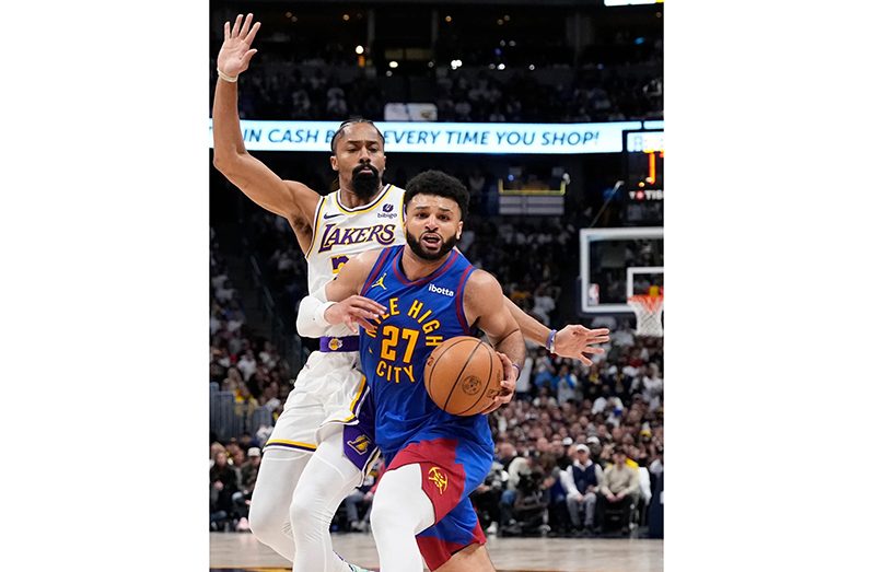 Nikola Jokic leads NBA champ Denver Nuggets past LeBron James and Lakers 114-103 in playoff opener.