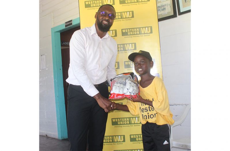Jerimiah Kelvin receives his award from Director of Sport Christopher Jones.